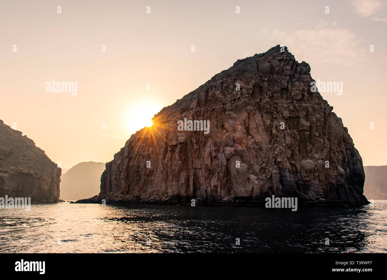 Sunset at fjords of Musandam peninsula near Khasab in Oman Stock Photo