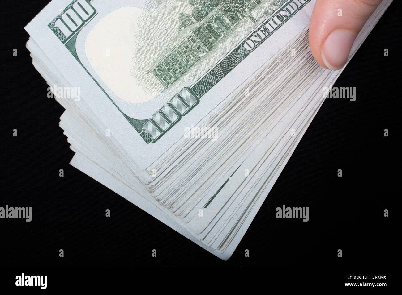 Hand holding American dollar banknotes isolated on white background ...