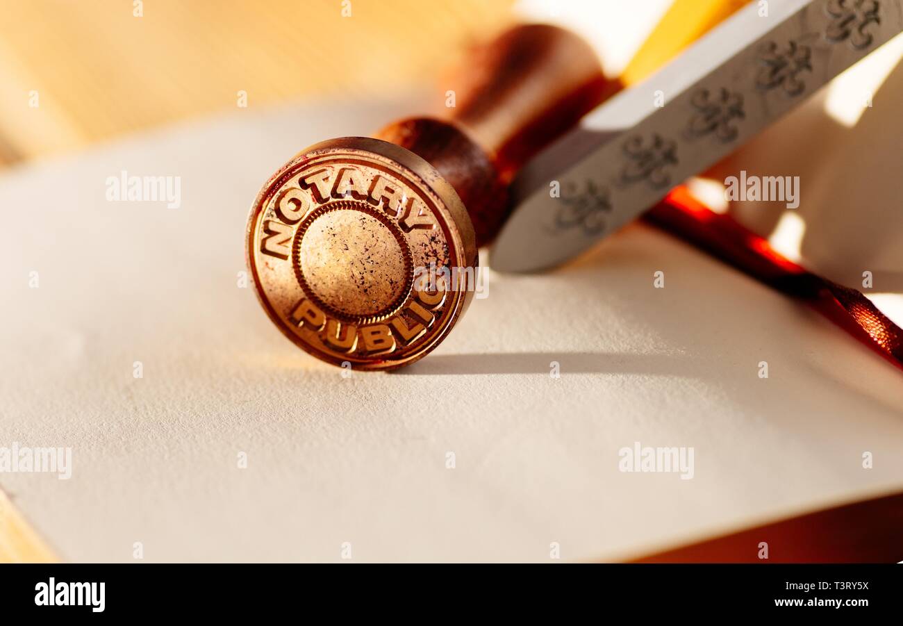 Notary public metal stamp on paper Stock Photo Alamy