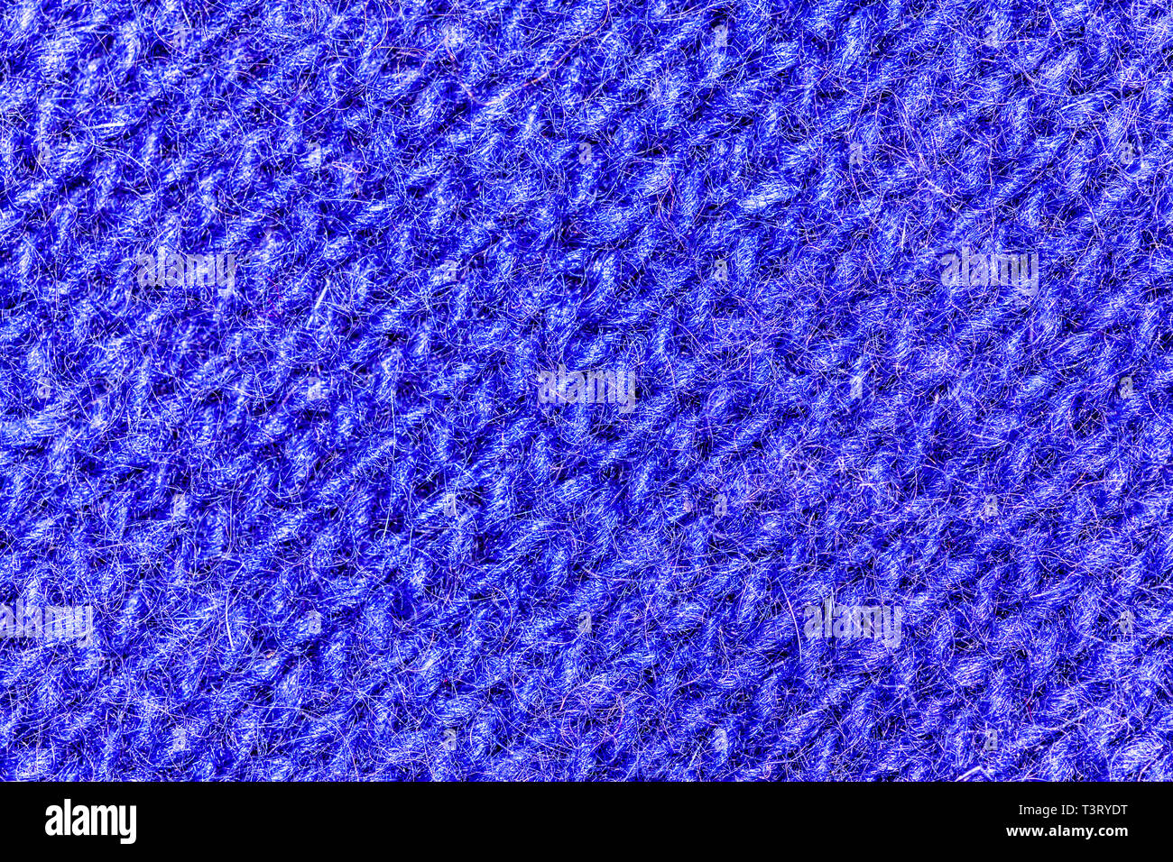 Macro view on the blue wool texture background. Very close macro photo on the pattern. Stock Photo