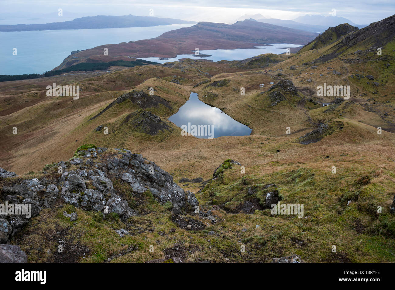 Lochan on the Trotternish ridge, with view across Loch Leathan and the Sound of Raasay, Isle of Skye, Highland Region, Scotland, UK Stock Photo