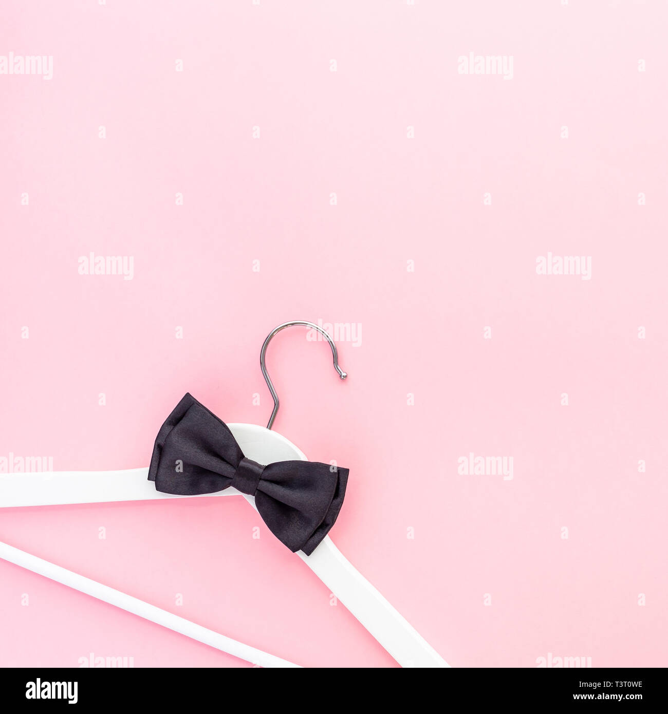 Creative top view flat lay white wooden hangers pastel millennial pink ...