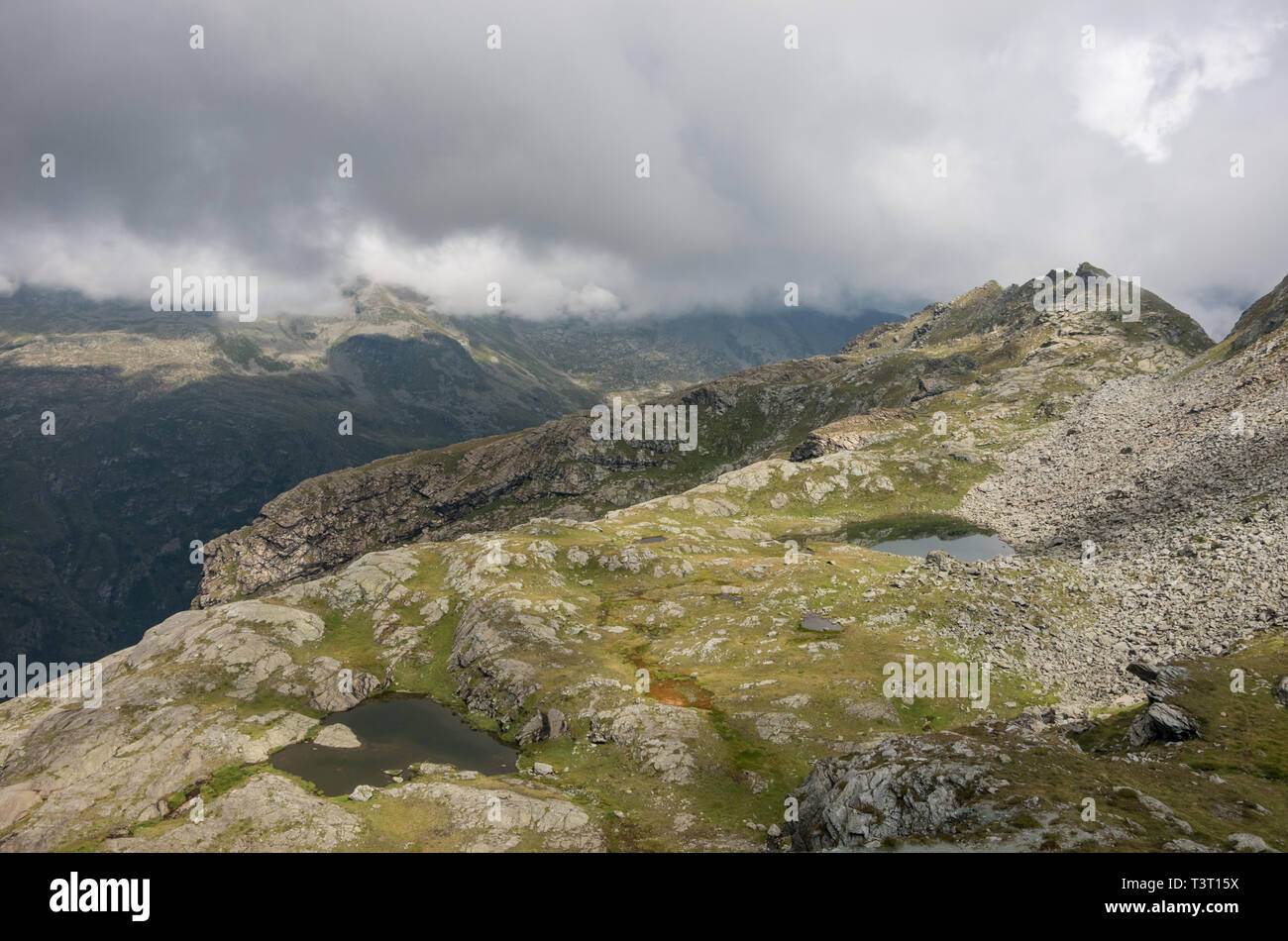 View to valley Bors from mountain slope with litile pond , Alagna Valsesia area, Italy Stock Photo