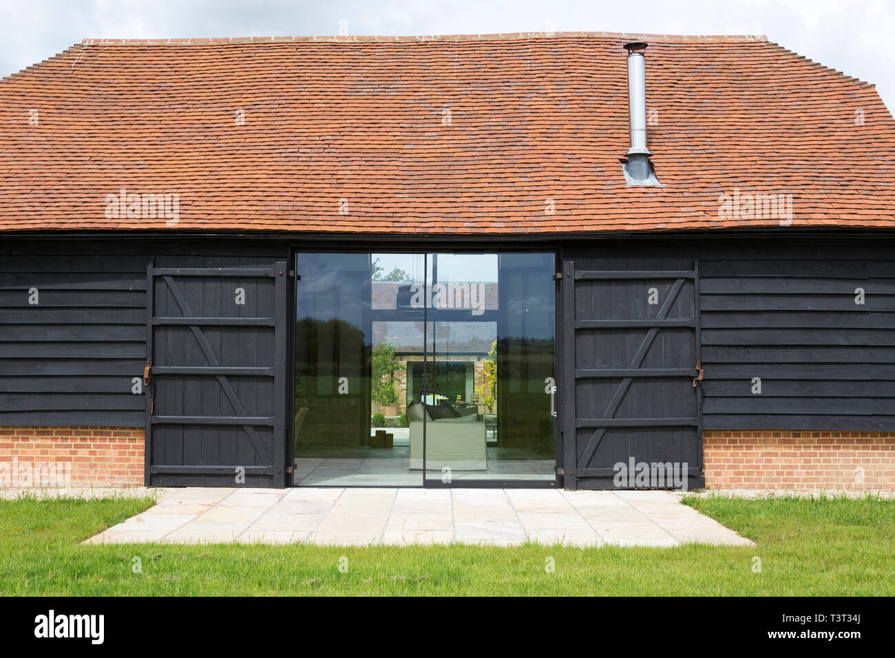 Glass Sliding Doors Of Converted Barn Home Stock Photo 243318450