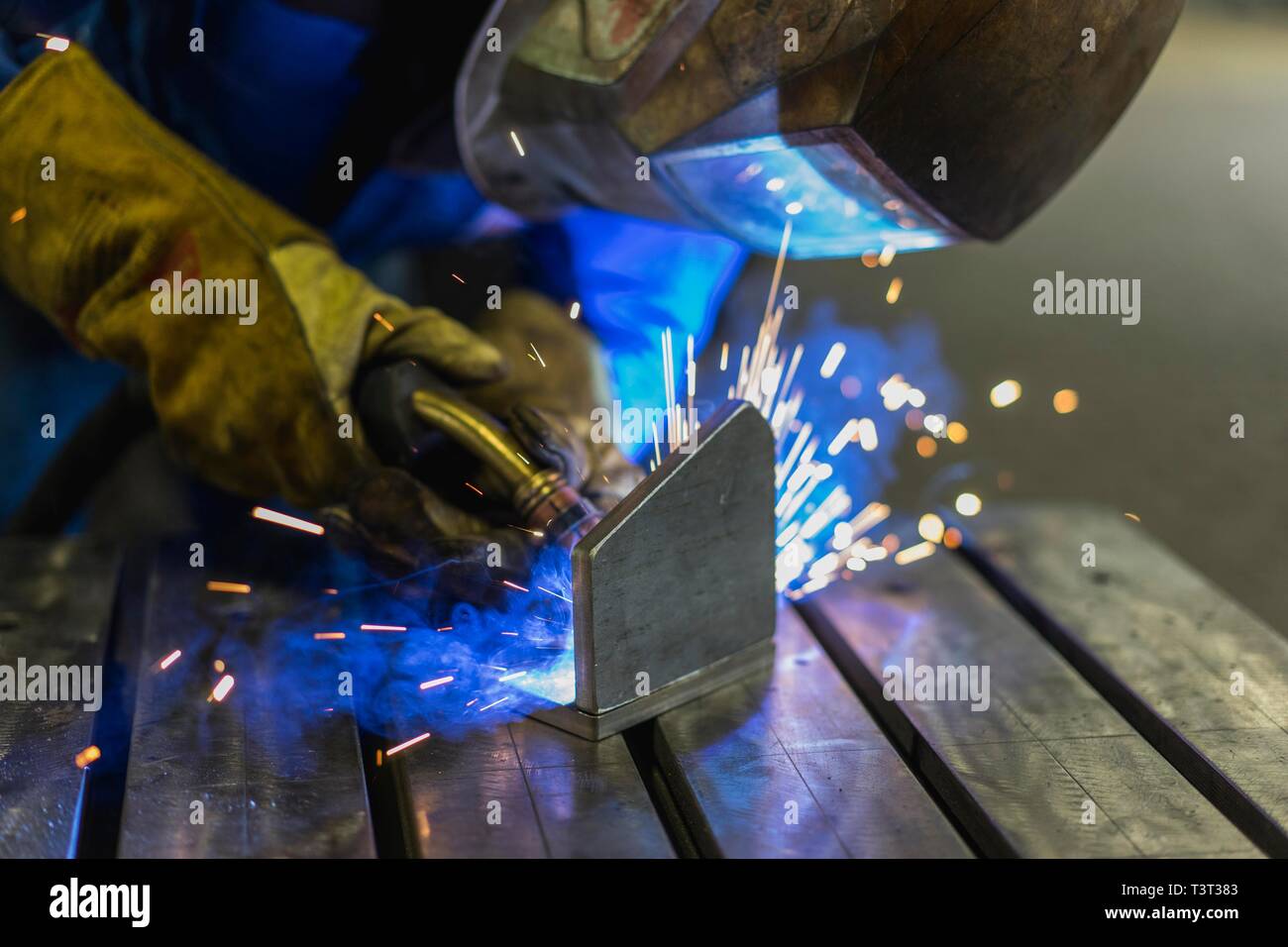 Welding with sparks on metal, welding together, Germany Stock Photo Alamy