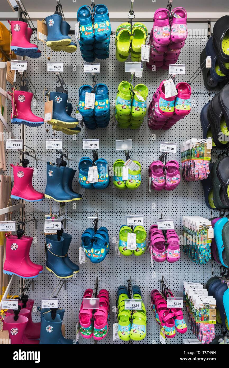 Children's clogs and rubber boots in hardware store, Munich, Upper Bavaria, Bavaria, Germany Stock Photo