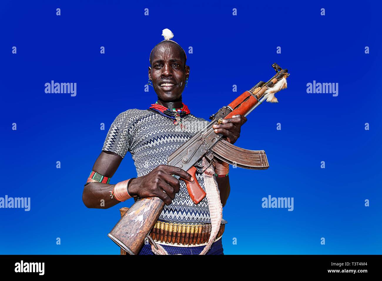Man with Kalashnikov, Hamer tribe, Mago National Park, Region of Southern Nations Nationalities and Peoples, Ethiopia Stock Photo