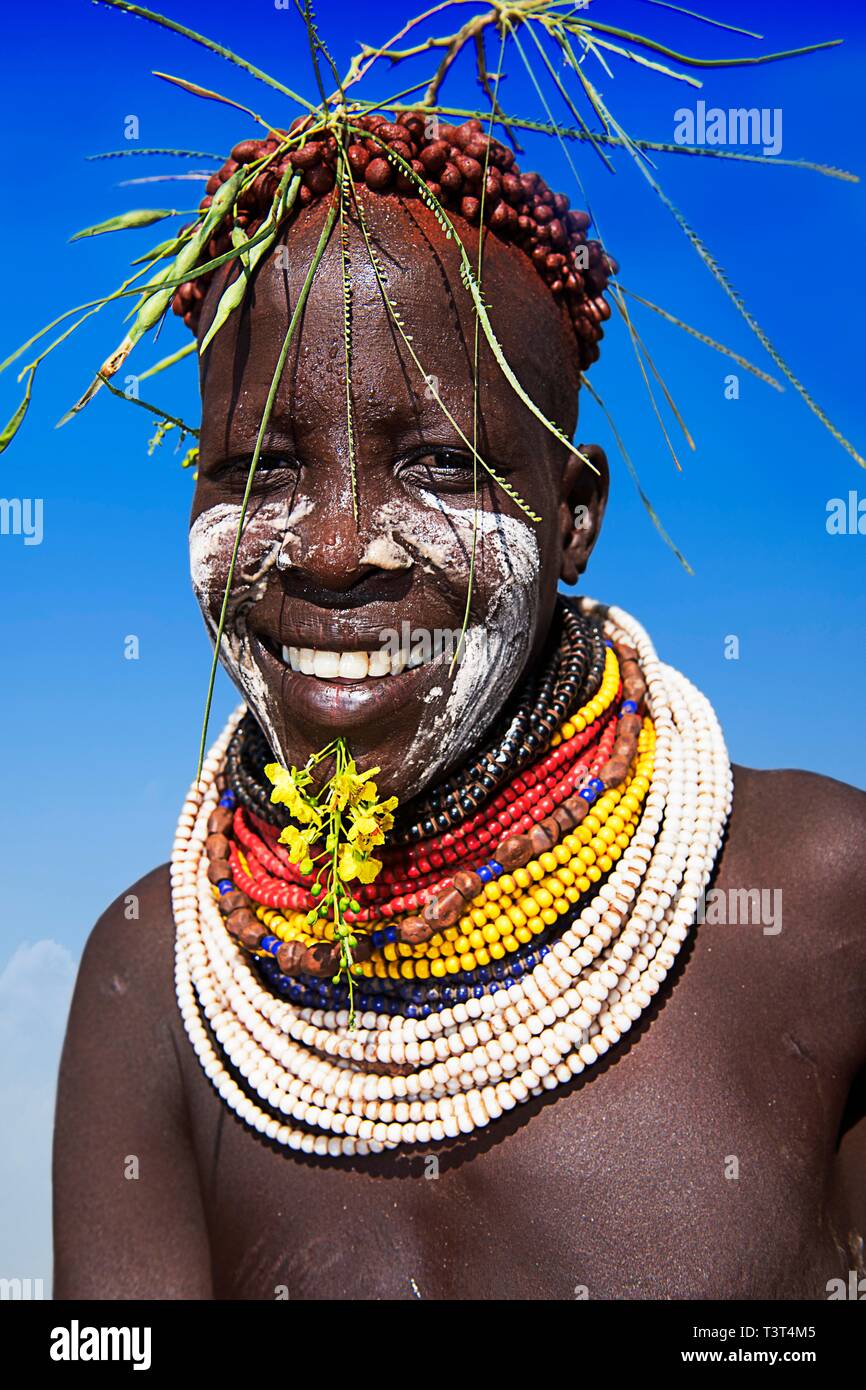 Woman with necklace and headdress, tribe of the Karo, village Duss, Mago national park, region of the southern nations nationalities and peoples Stock Photo