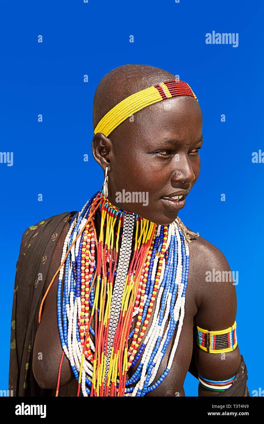 Woman with many pearl necklaces as necklace, portrait, tribe of the Erbore, Mago national park, region of the southern nations nationalities and Stock Photo