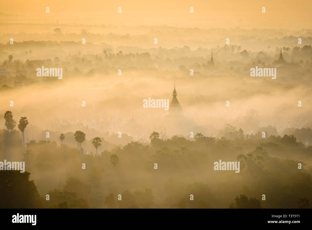 Aerial view of towers in misty landscape Stock Photo - Alamy