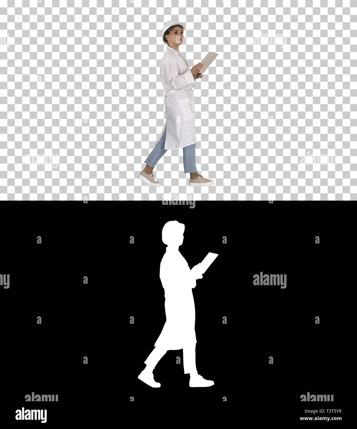 Young technician inspecting and taking necessary notes on digital tablet, Alpha Channel Stock Photo