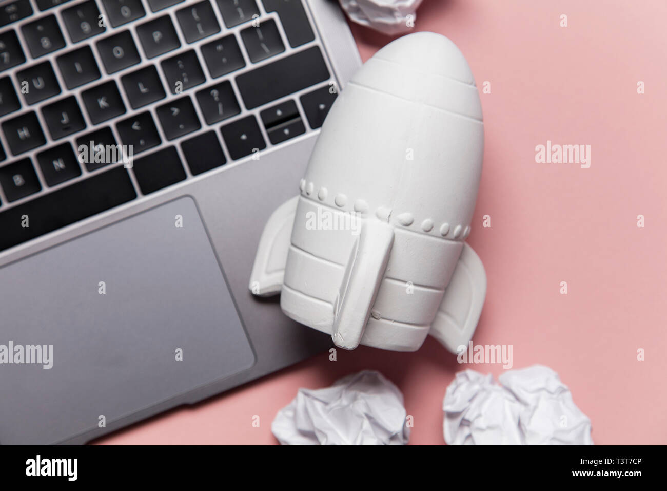 Business startup concept. Rocket taking off with crumpled paper trail Stock Photo