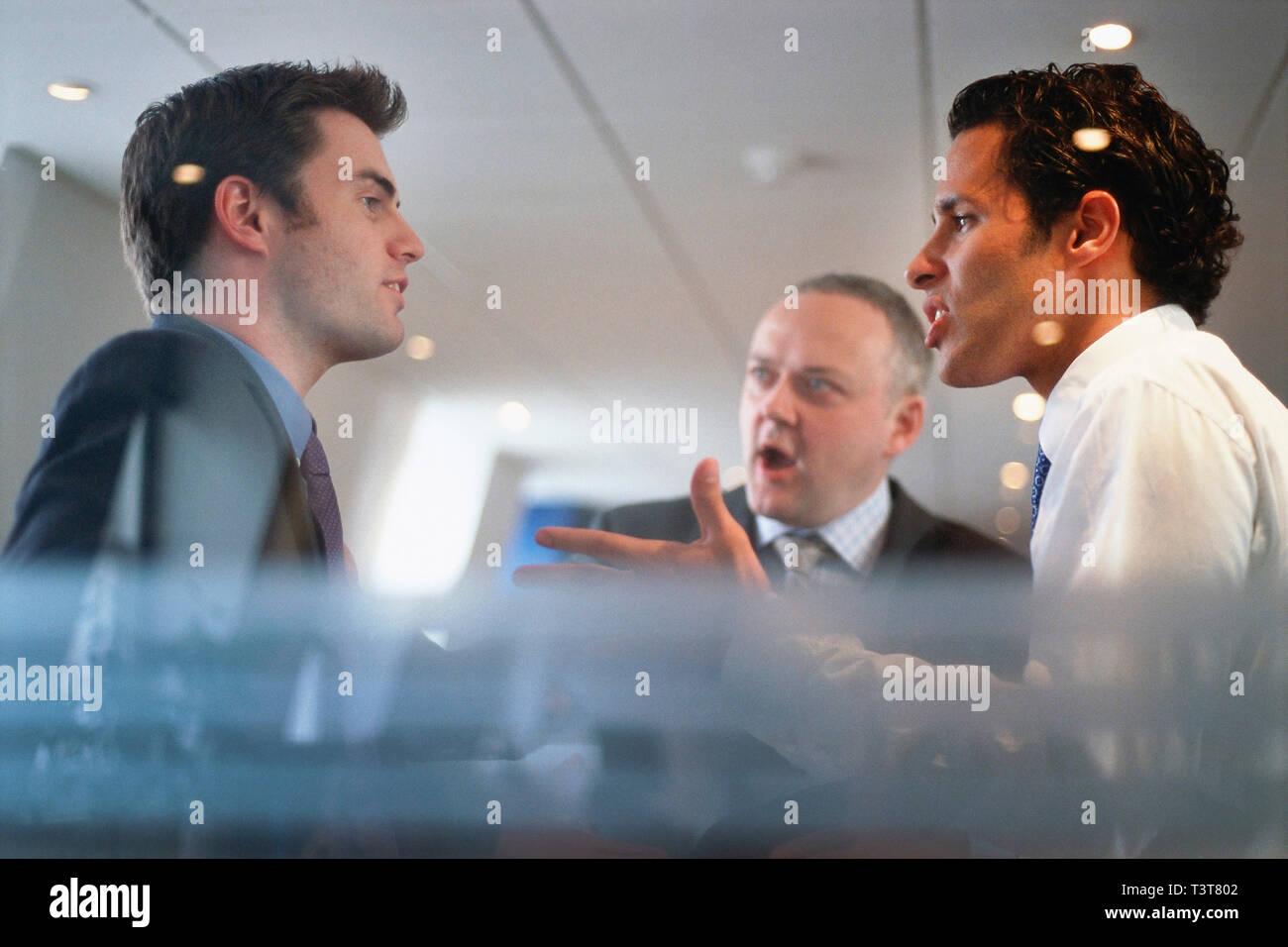 Caucasian businessmen arguing in office Stock Photo