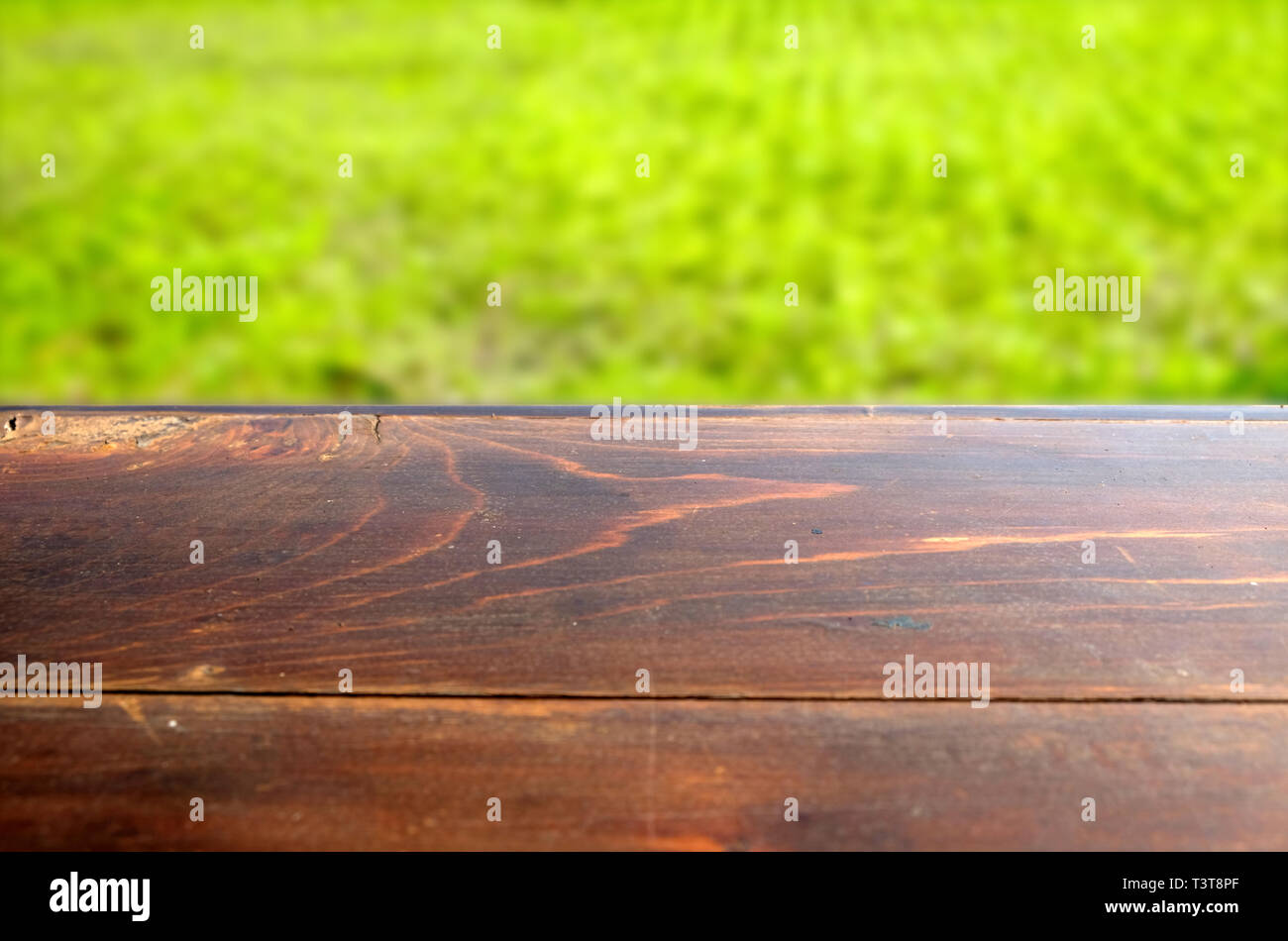 Empty Wood Table Top On Blur Abstract Green From Garden In Morning Background Can Be Used For