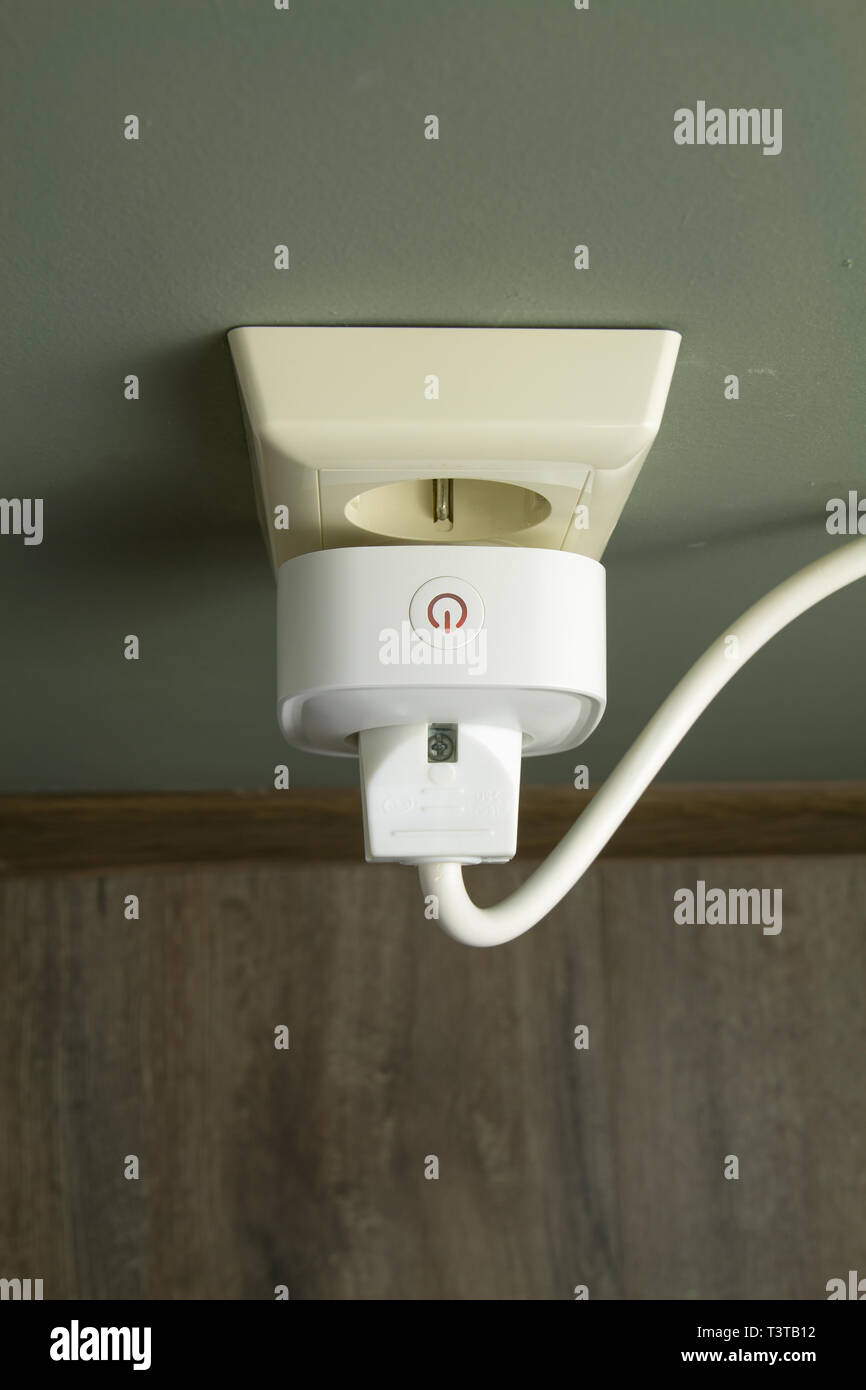 WI FI smart socket with a household electrical appliance included in it Stock Photo