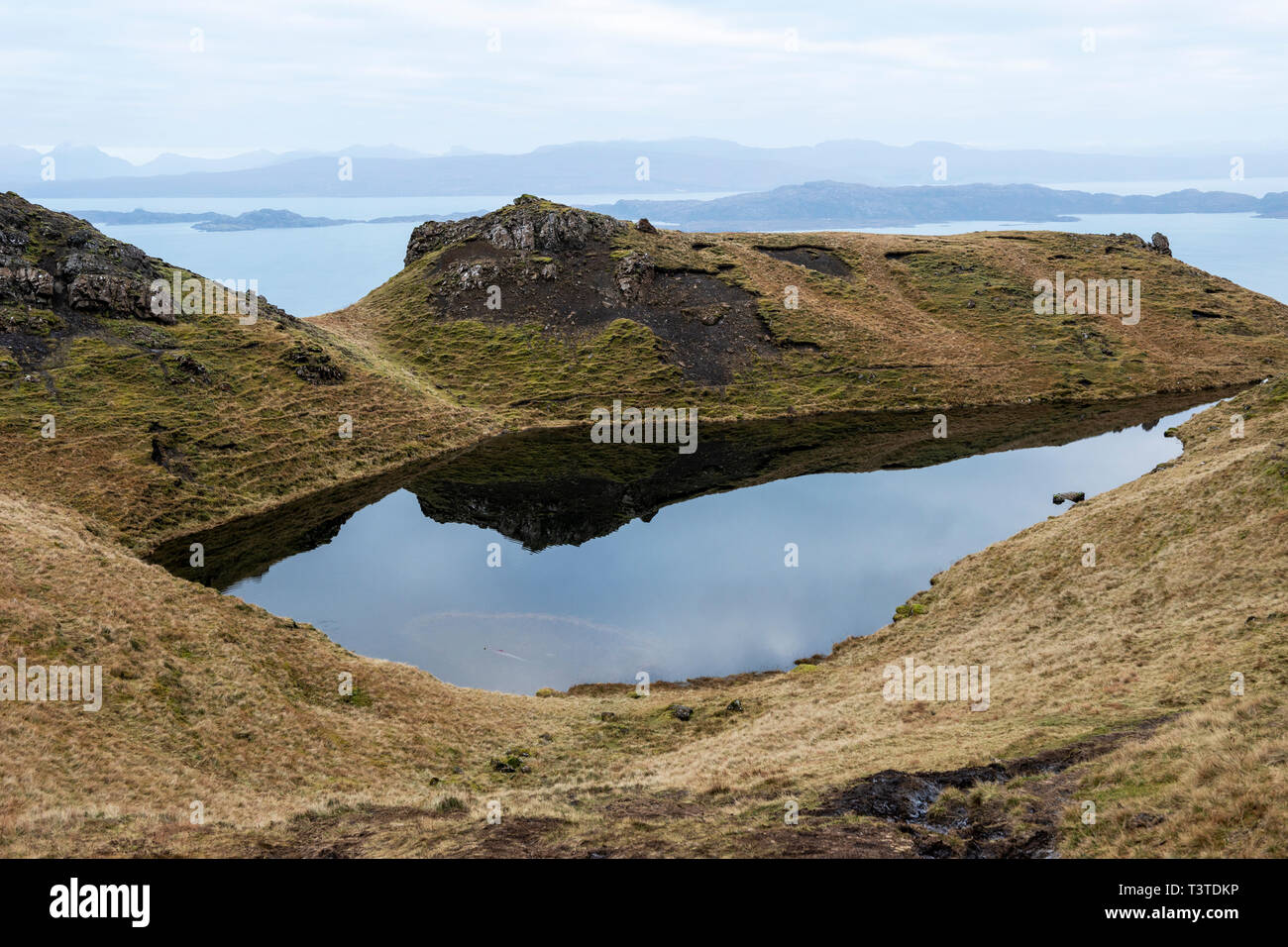 Lochan on the Trotternish ridge, with view across Loch Leathan and the Sound of Raasay, Isle of Skye, Highland Region, Scotland, UK Stock Photo