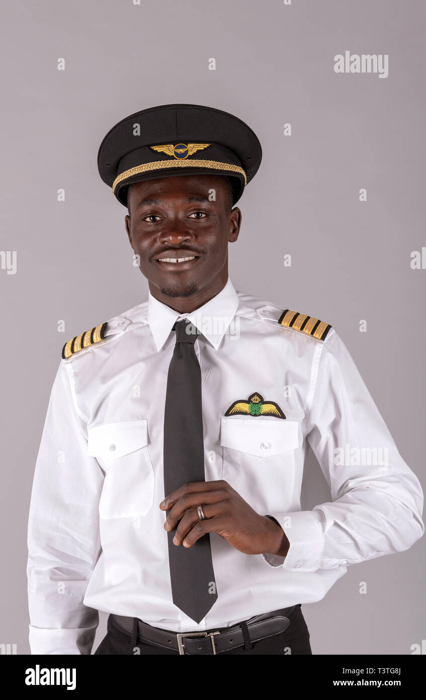 Portrait of a young airline pilot wearing a captain's uniform Stock Photo -  Alamy