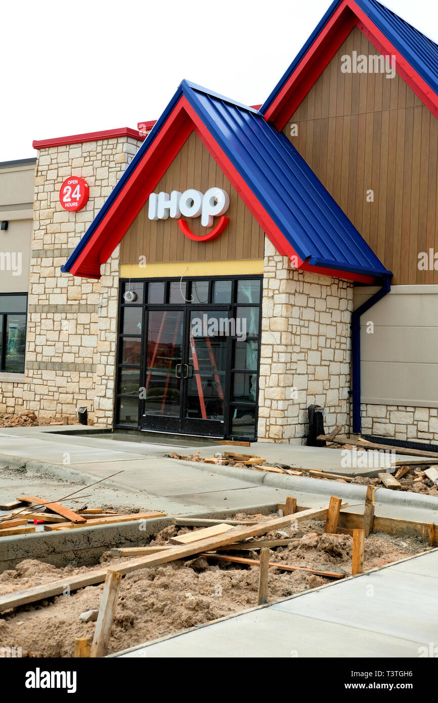 New IHOP restaurant location in 2019, under construction; IHOP logo on a restaurant exterior; College Station, Texas, USA. Stock Photo