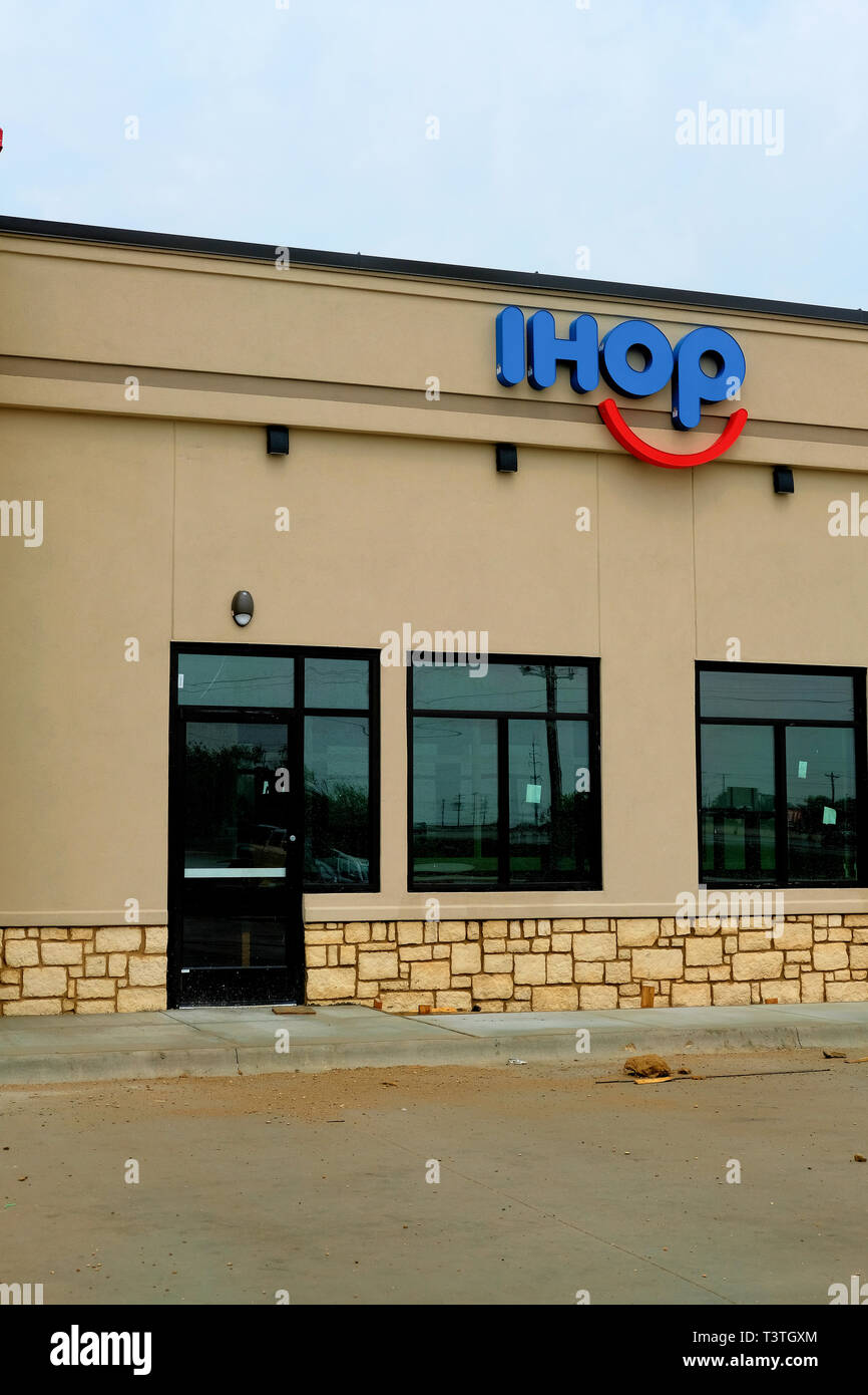 New IHOP restaurant location in 2019, under construction; IHOP logo on a restaurant exterior; College Station, Texas, USA. Stock Photo