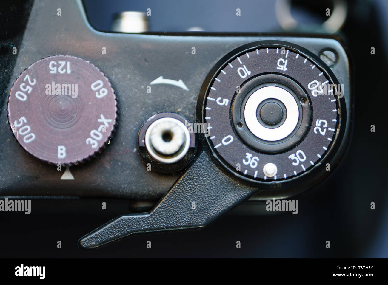 Close-Up Top View of the Shutter Button of the Old Black Steel Film SLR Camera. Stock Photo