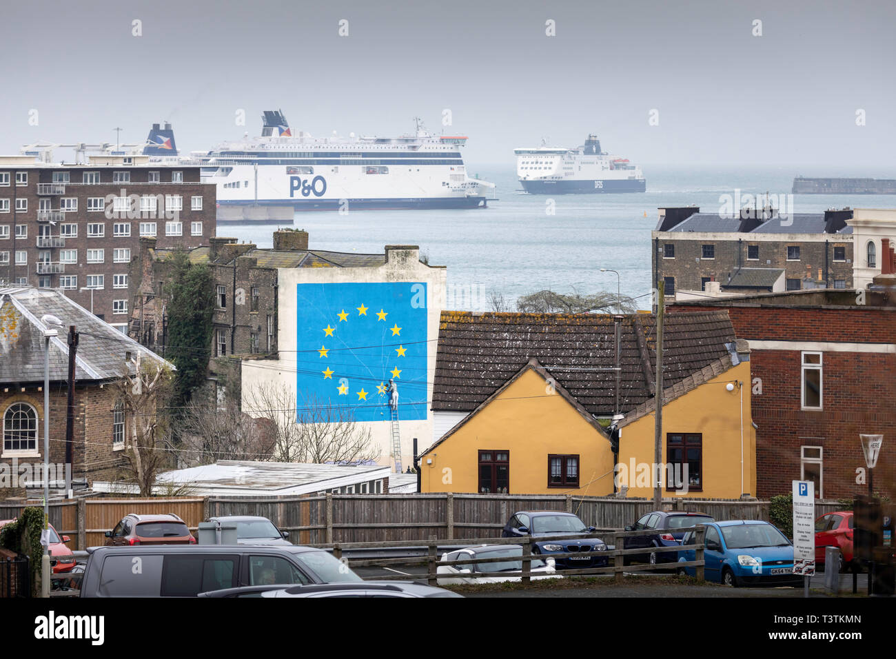 What next for Brexit?? A ferry approaches the Port of Dover where Banksy's famous Brexit mural stands large on the side of a derelict building.   Pict Stock Photo