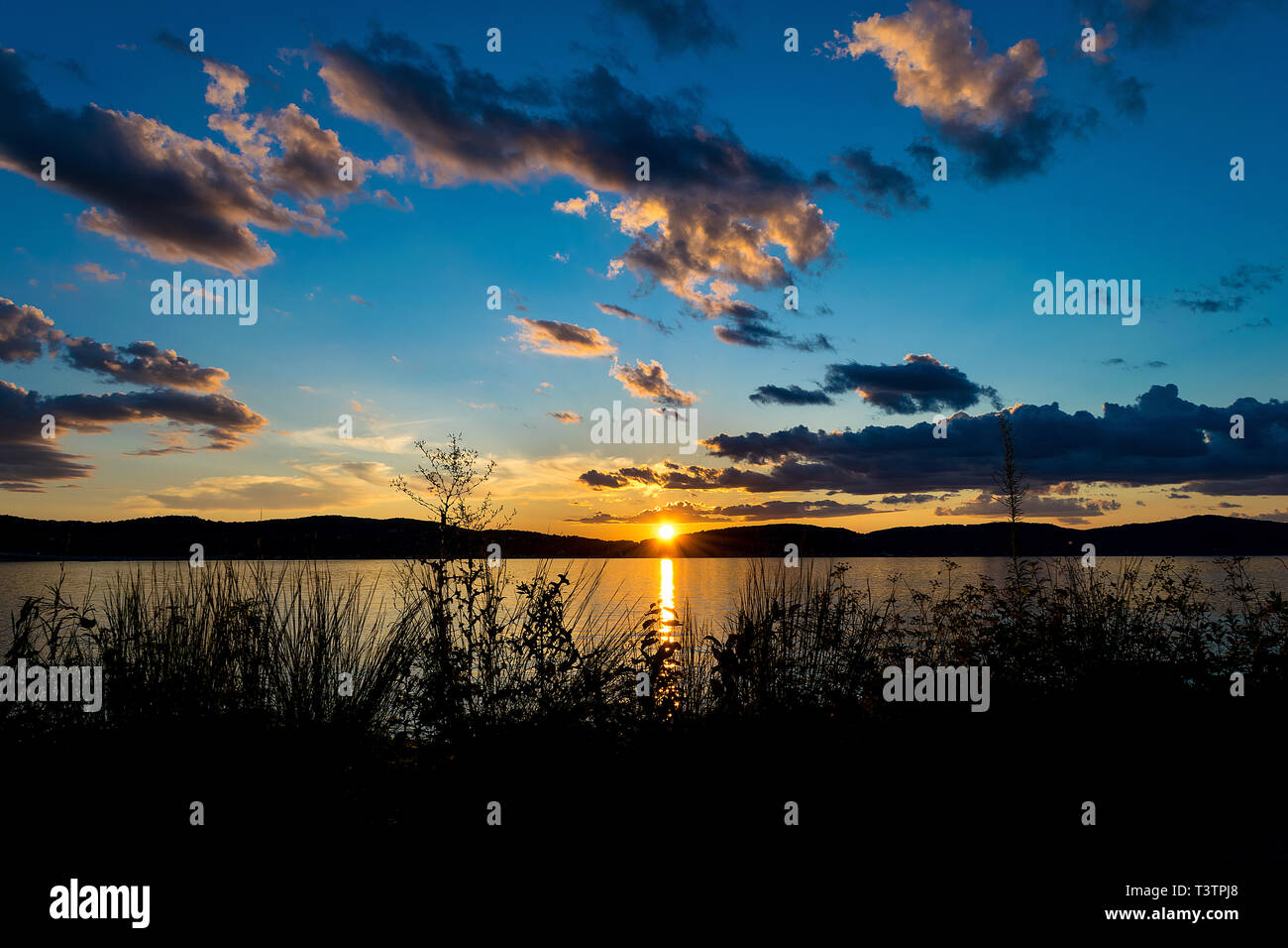 Dramatic cloud formations and blue sky above the Hudson River as the