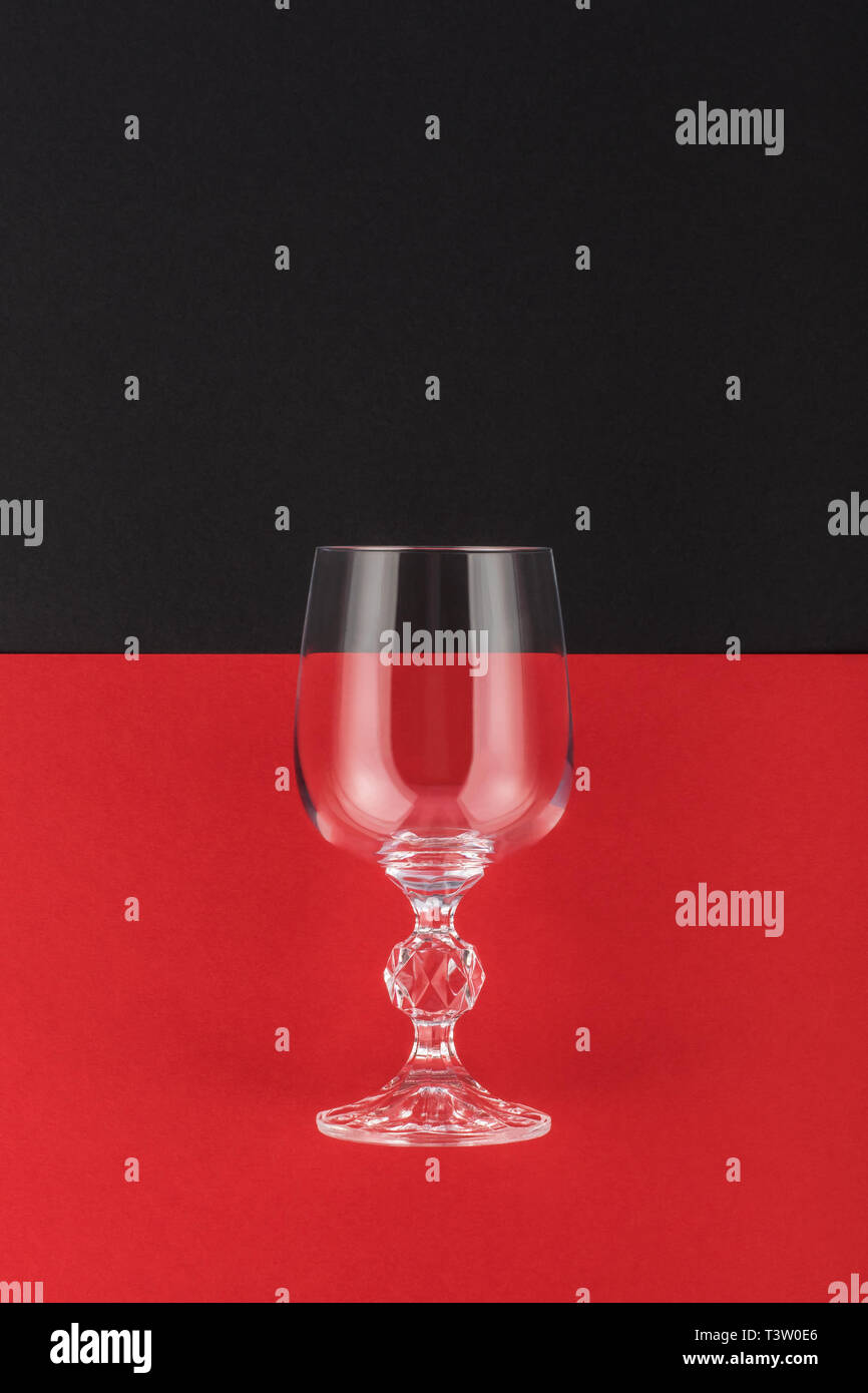 Wine glass on black and red background. Wine symbol Stock Photo