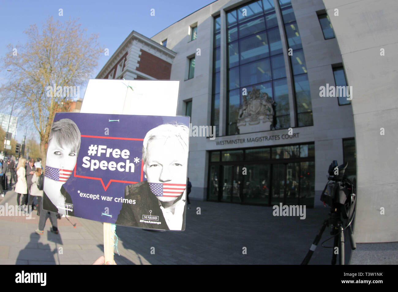 Placard saying, Free Speech, of Julian Assange seen outside Westminster Magistrates Court after Julian Assange was removed from the Ecuadorian Embassy after his asylum was terminated. Stock Photo
