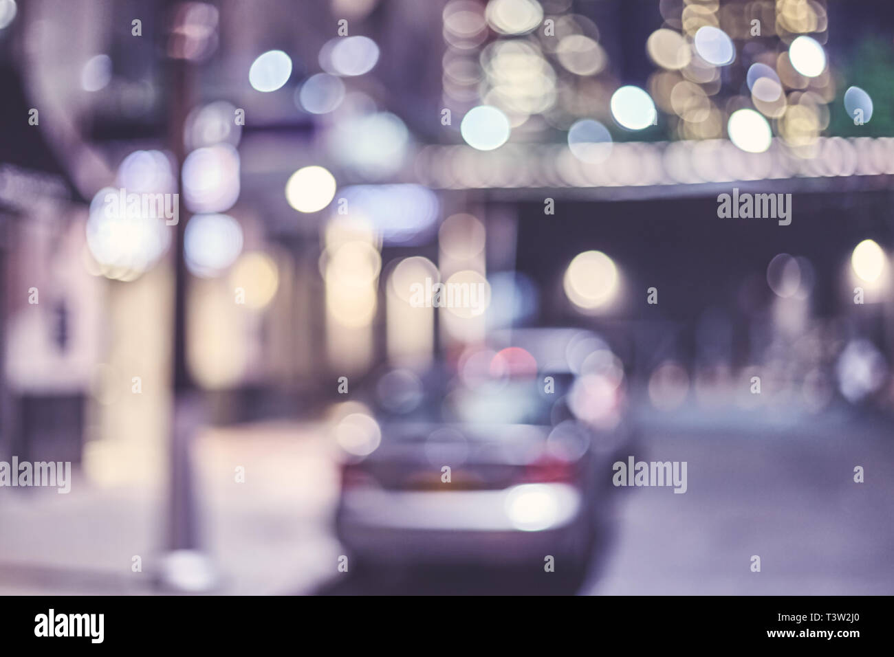 Blurred New York city street at night, color toned urban abstract ...