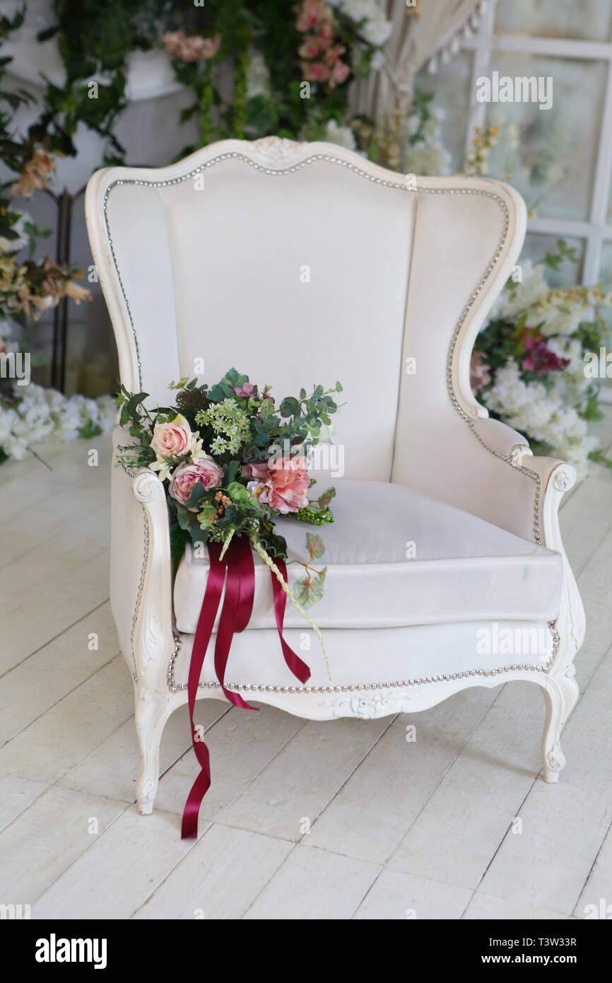 Beautiful, leather chair in the room near the orchids Stock Photo