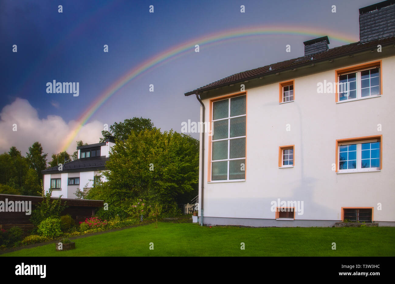 Rainbow over a house Stock Photo
