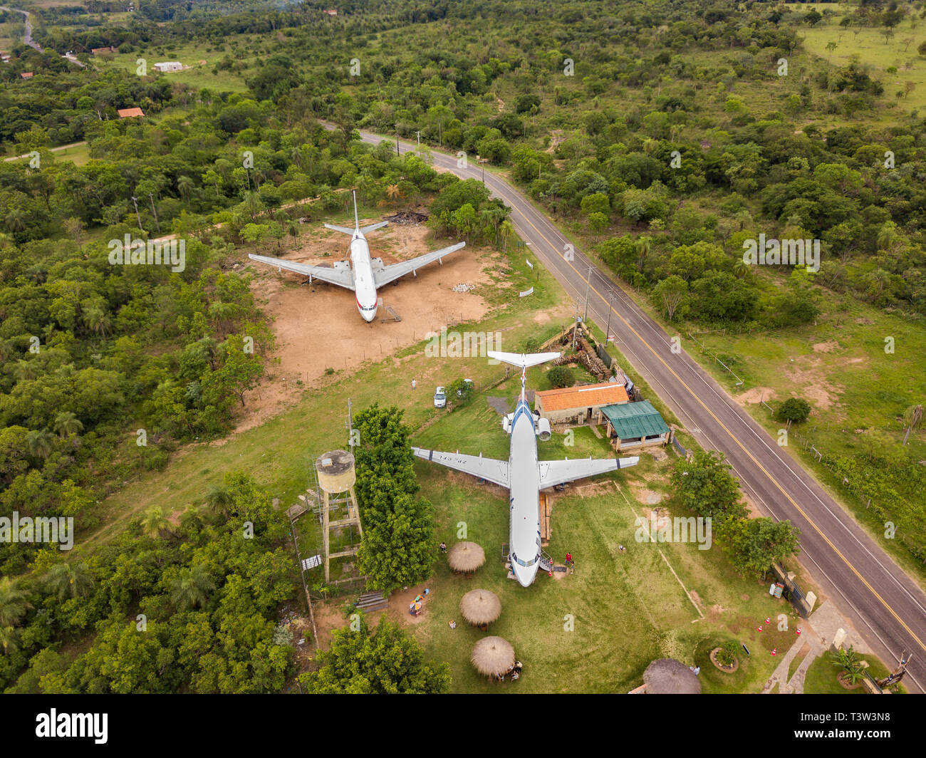 Loma Grande, Paraguay - 07 November 2017: Aerial view of two discarded aircraft on a private lot. The plots around the aircraft are for sale. Stock Photo