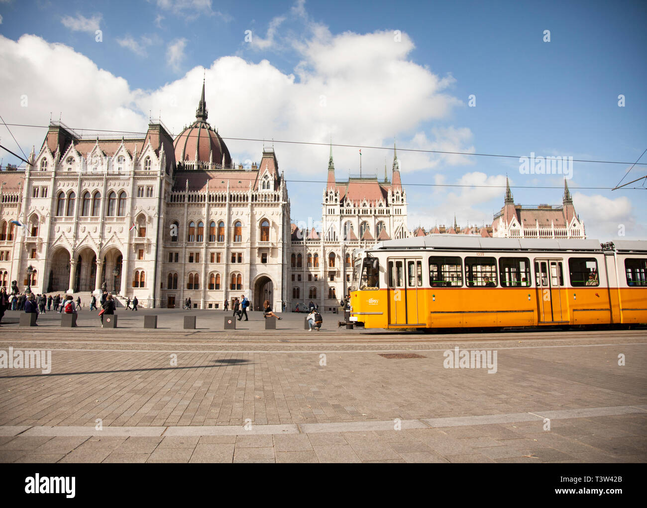 BUDAPEST, HUNGARY - SEPTEMBER 22, 2017: A public transit streetcar passes by the Hungarian Parliament buildings in Budapest. Stock Photo