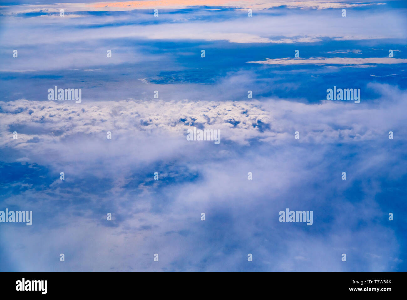 Sea of blue and white clouds seen from above Stock Photo - Alamy