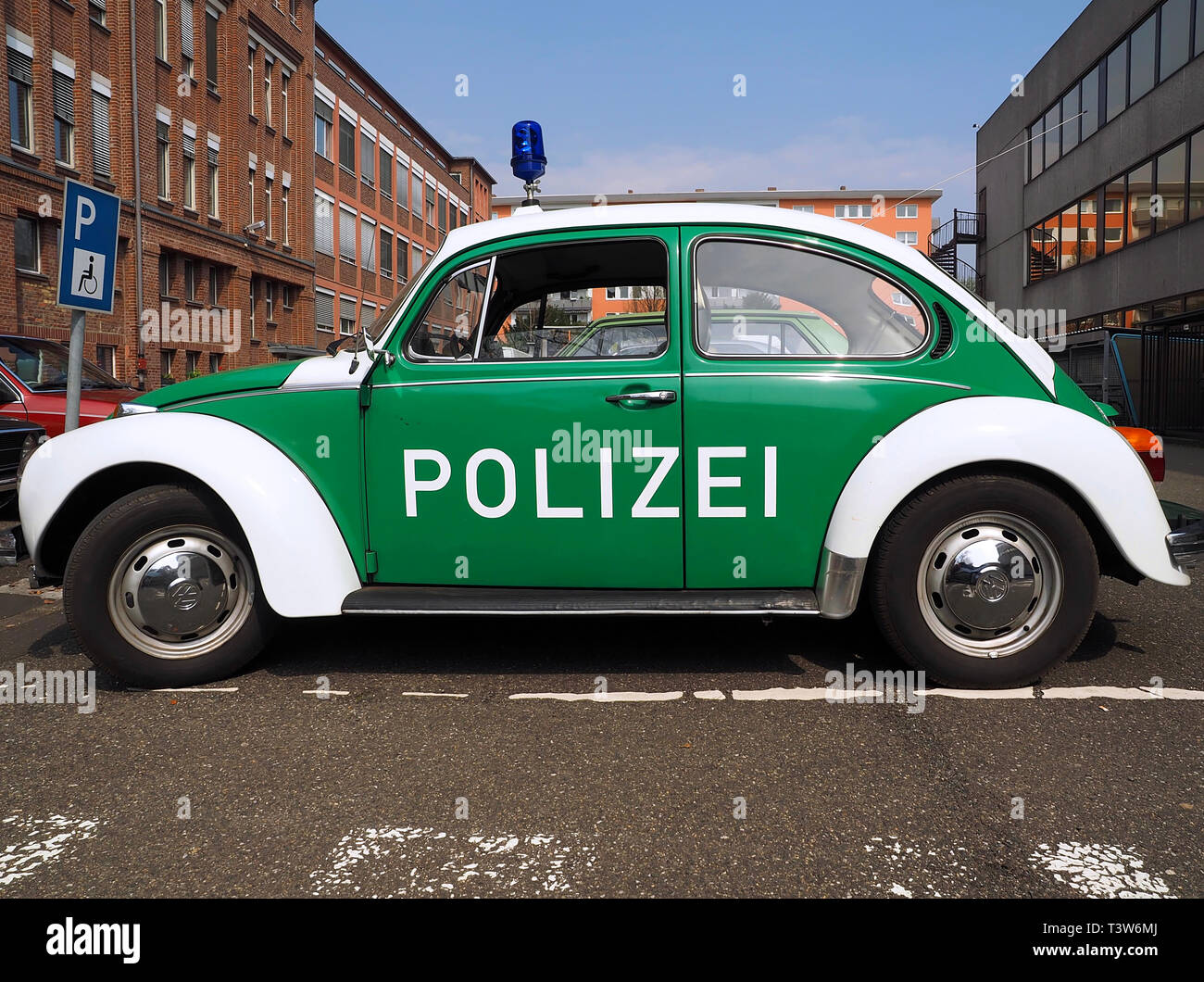 Old green VW beetle police car Stock Photo