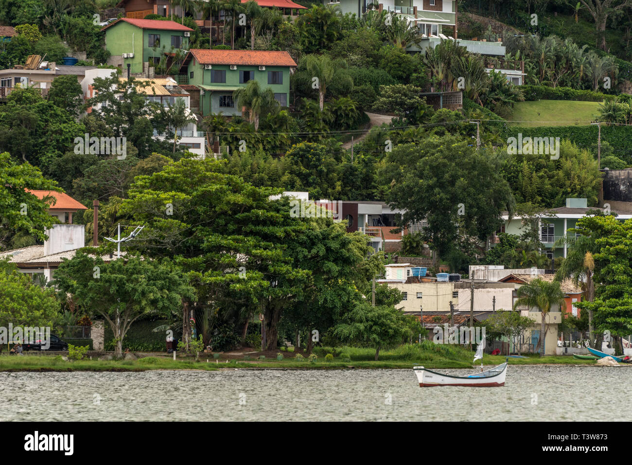 2019, January. Florianopolis, Brazil. Confort houses at the hill side near the Conceicao Lagoon. Stock Photo
