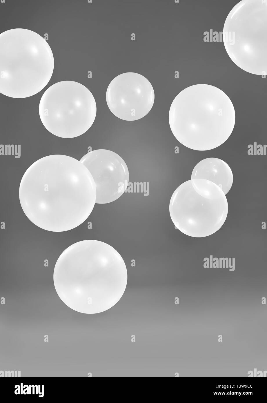 White balloons on dark grey background Stock Photo