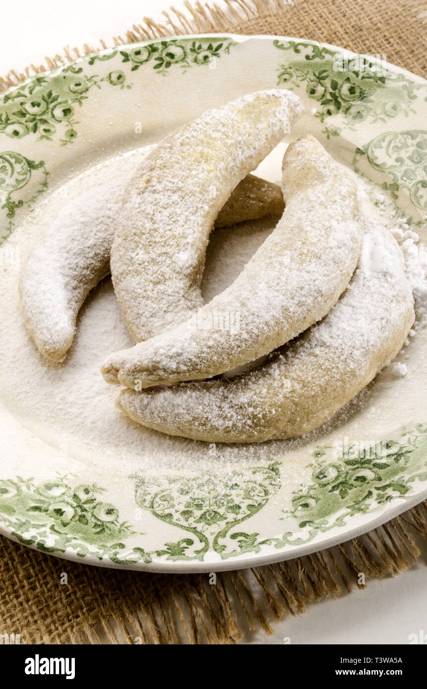 classic vanilla kipferl, traditional german cookies with powdered sugar on a plate Stock Photo