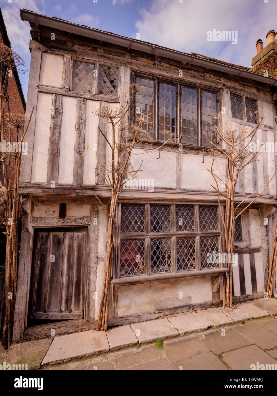 Alastair Hendy and his restored tudor home in Old Town Hastings, East Sussex UK. Stock Photo