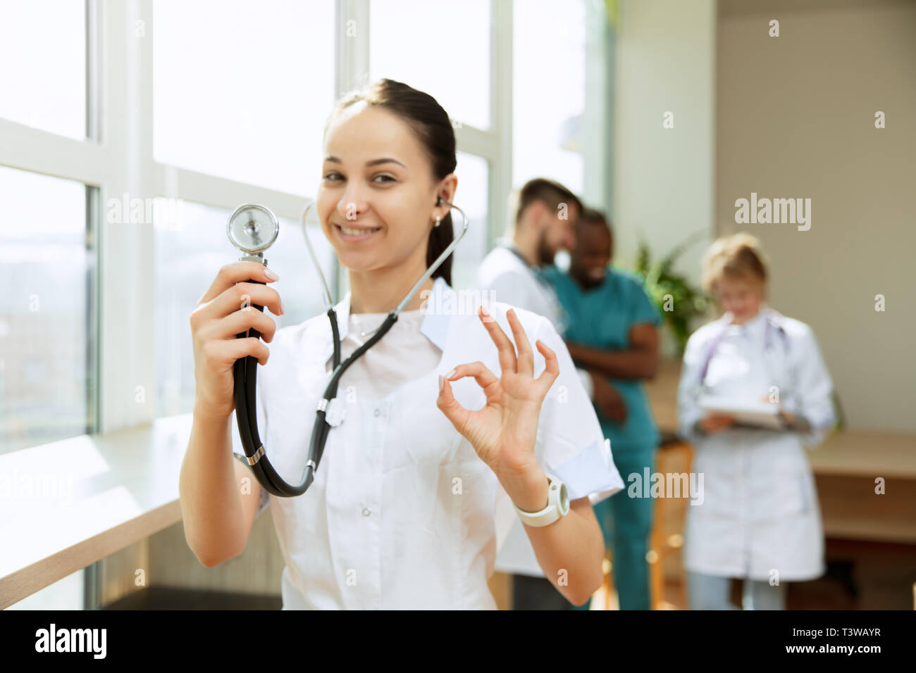 Healthcare people group. Professional female doctor posing at hospital