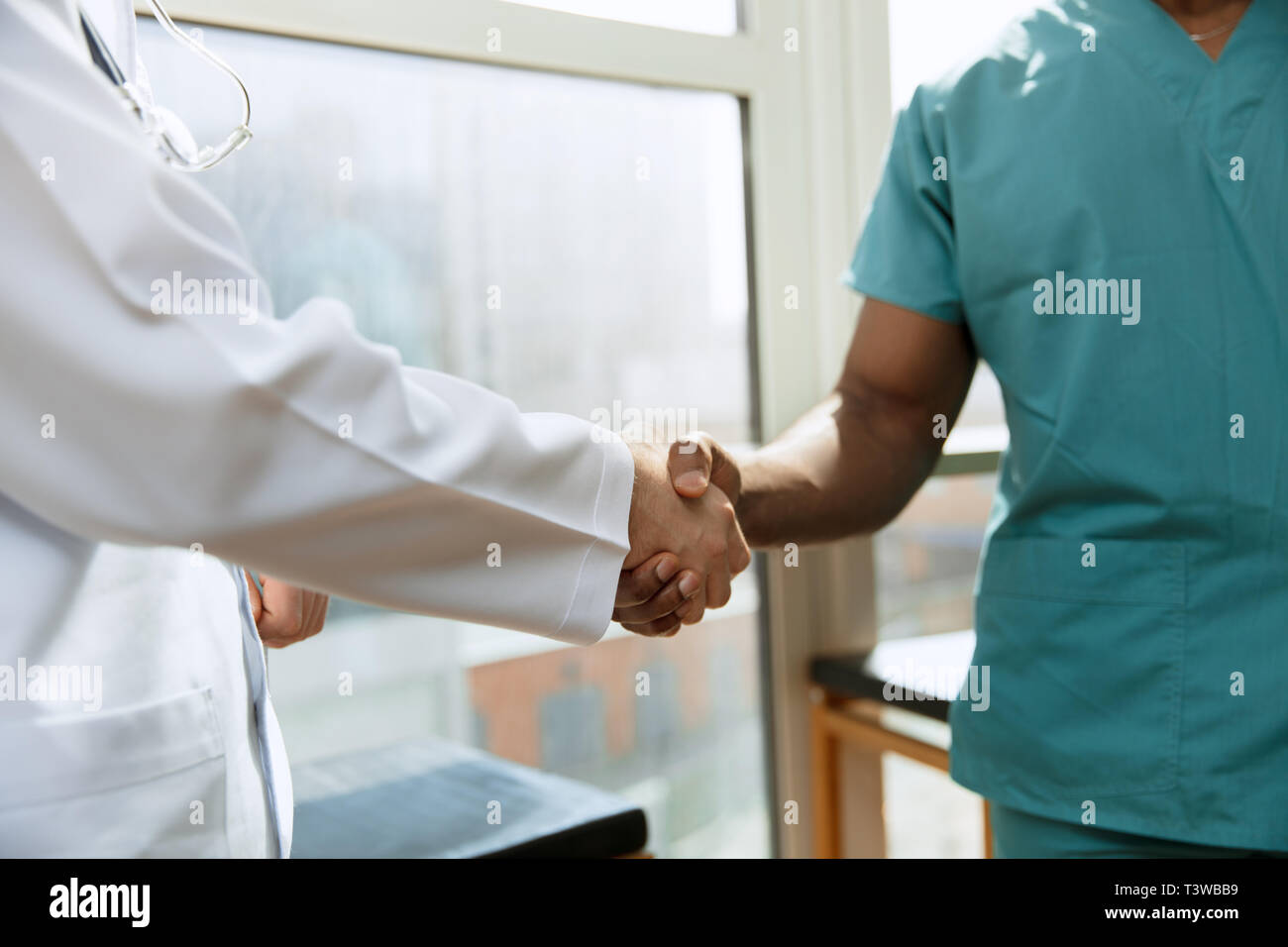 Deal. Concept of collaboration in medicine. Close up photo of two