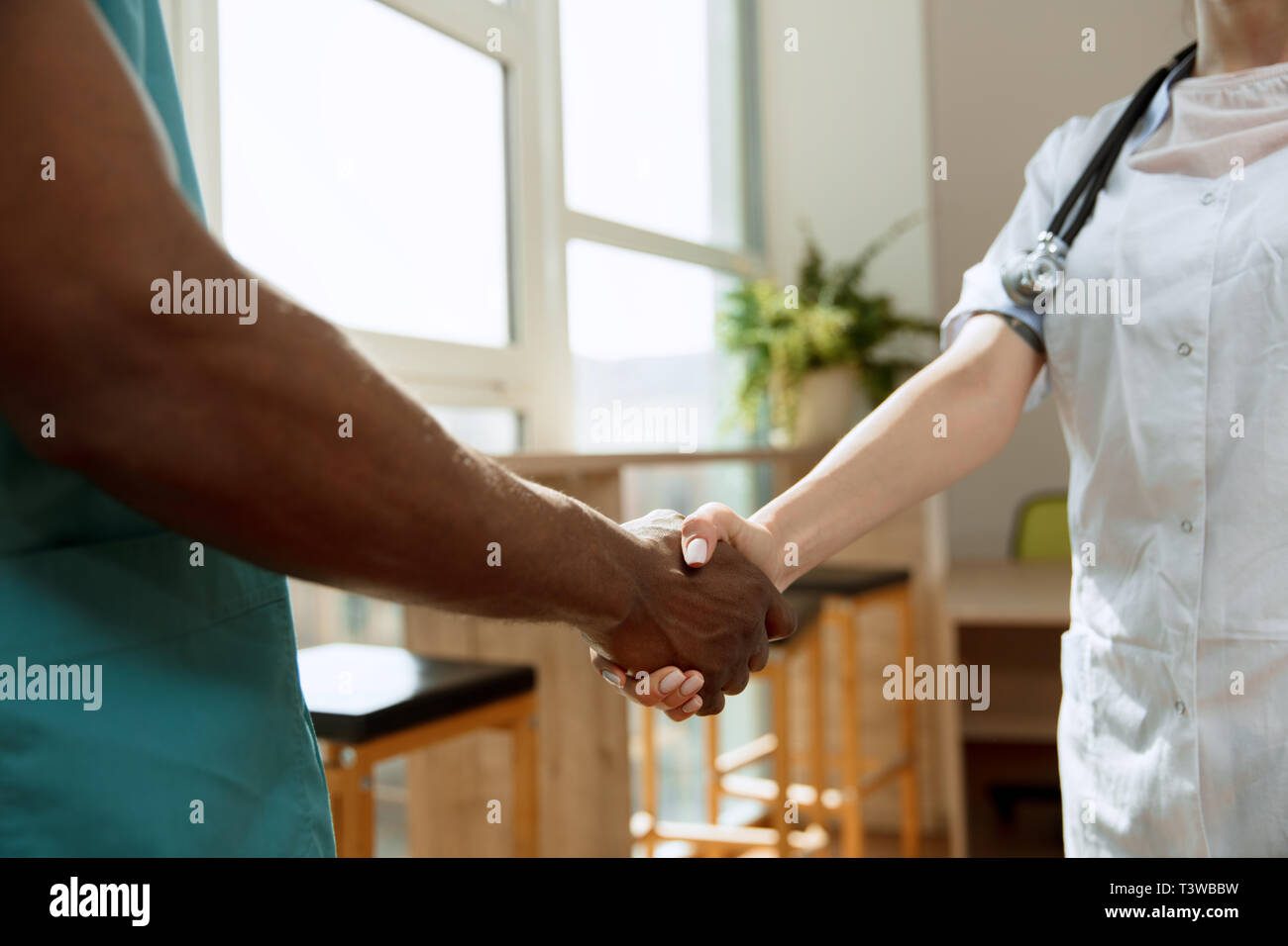 Deal. Concept of collaboration in medicine. Close up photo of two