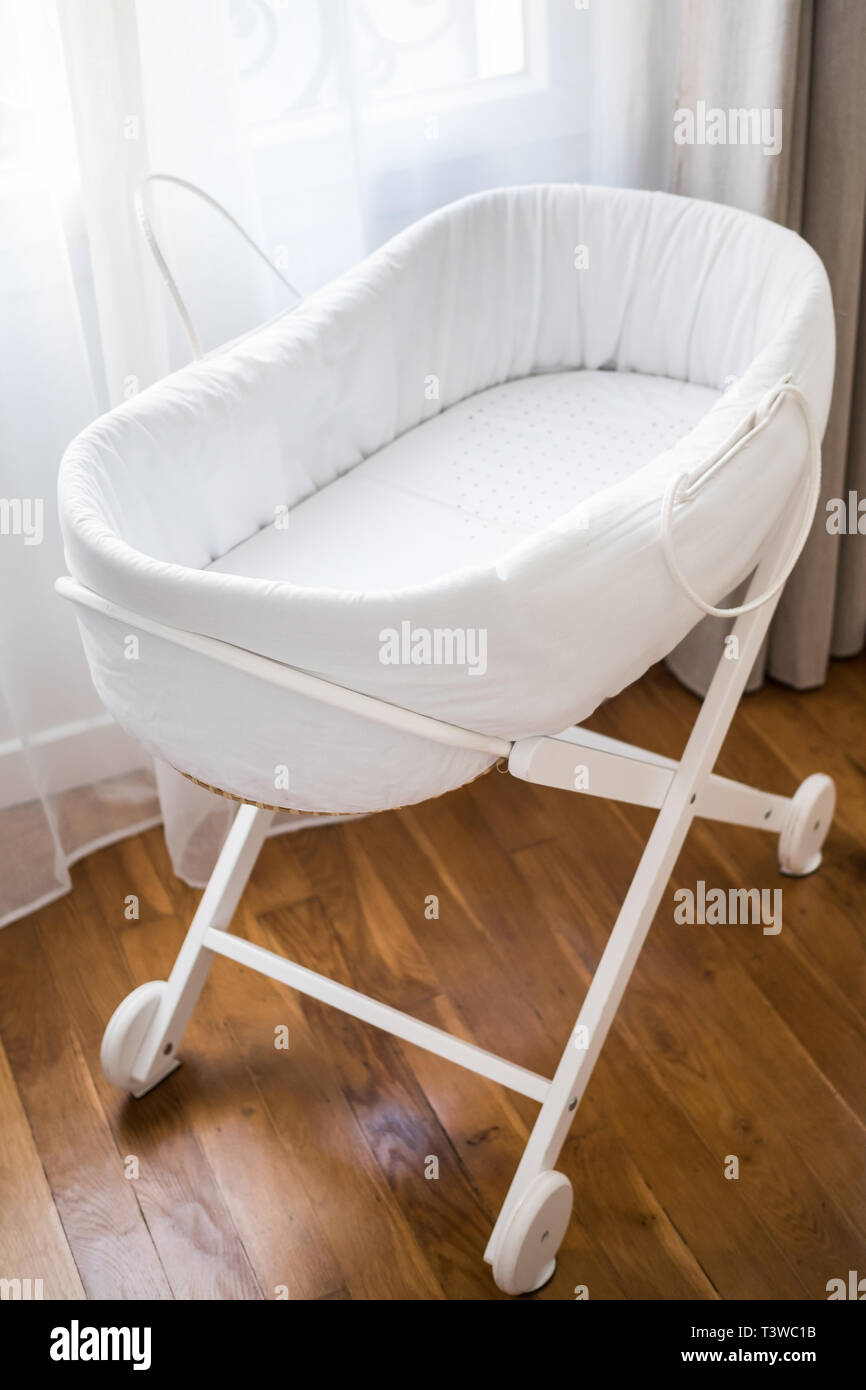 Nice white cradle for baby Stock Photo