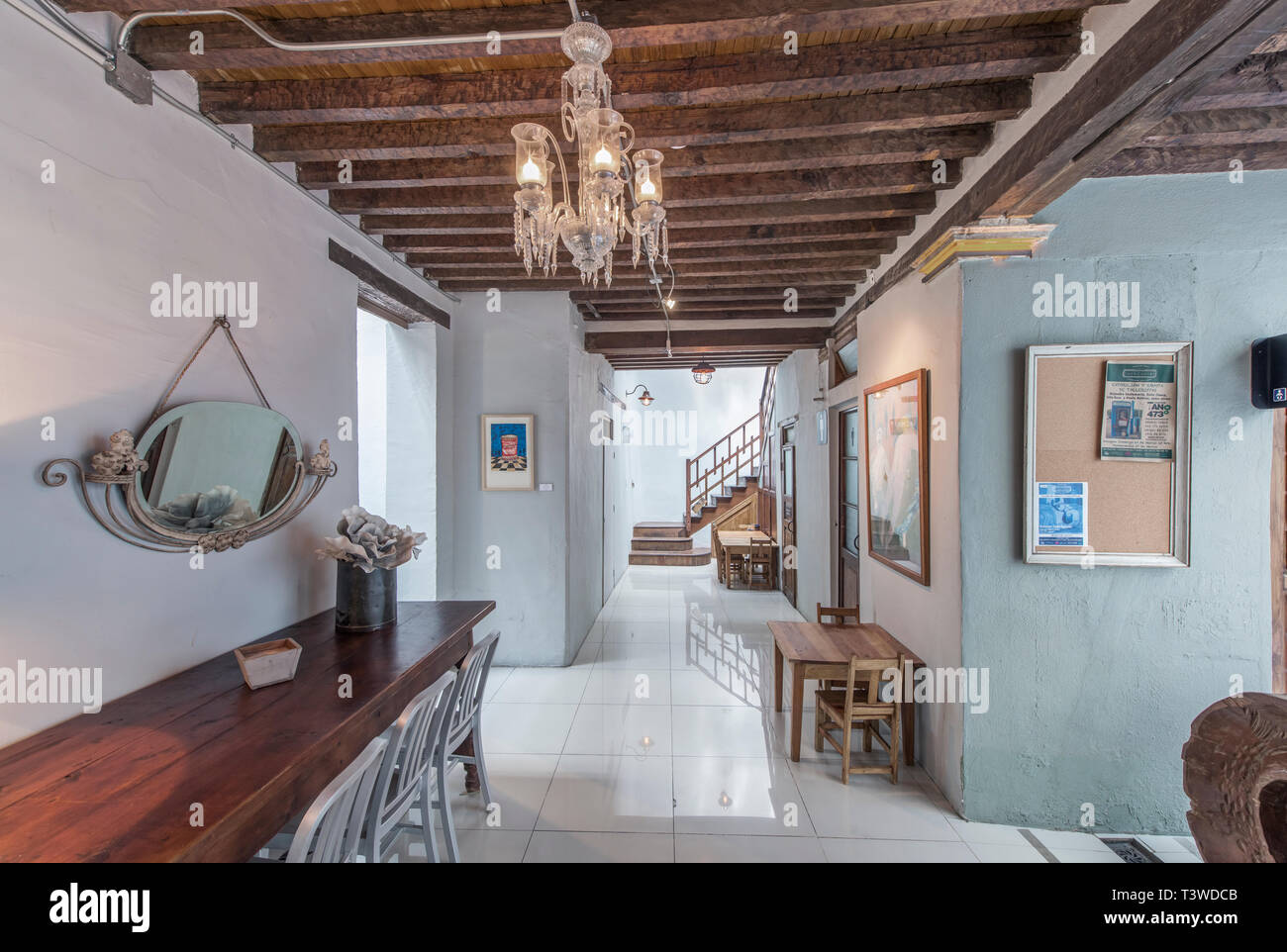 Chandelier And Benches In Modern Hallway Stock Photo 243348459