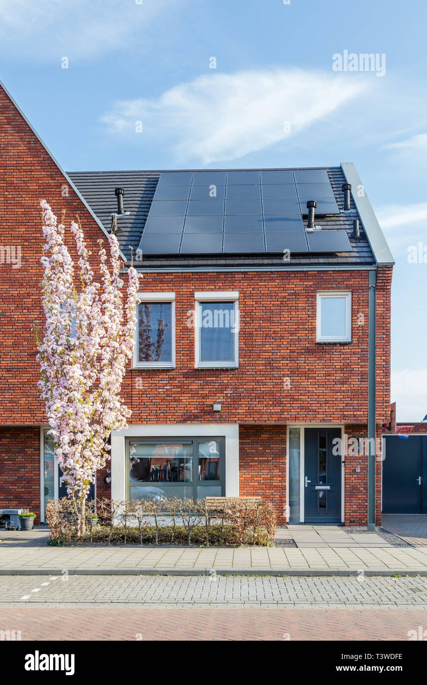 Newly built houses in a family friendly modern suburban neighborhood with solar panels en