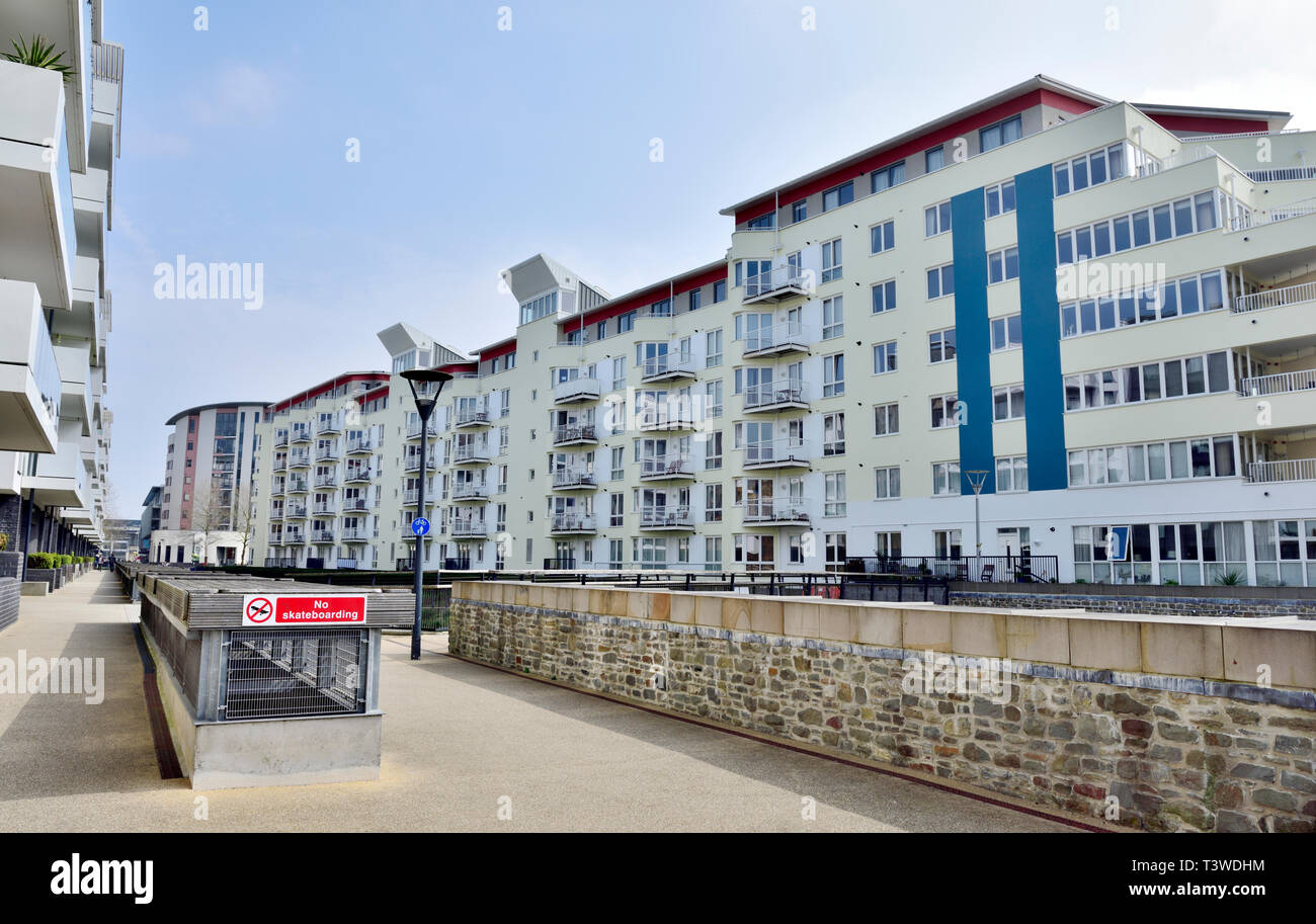 Modern purpose build apartments and flats along Millennium Promenade by Bristol Harbourside near city centre, England Stock Photo