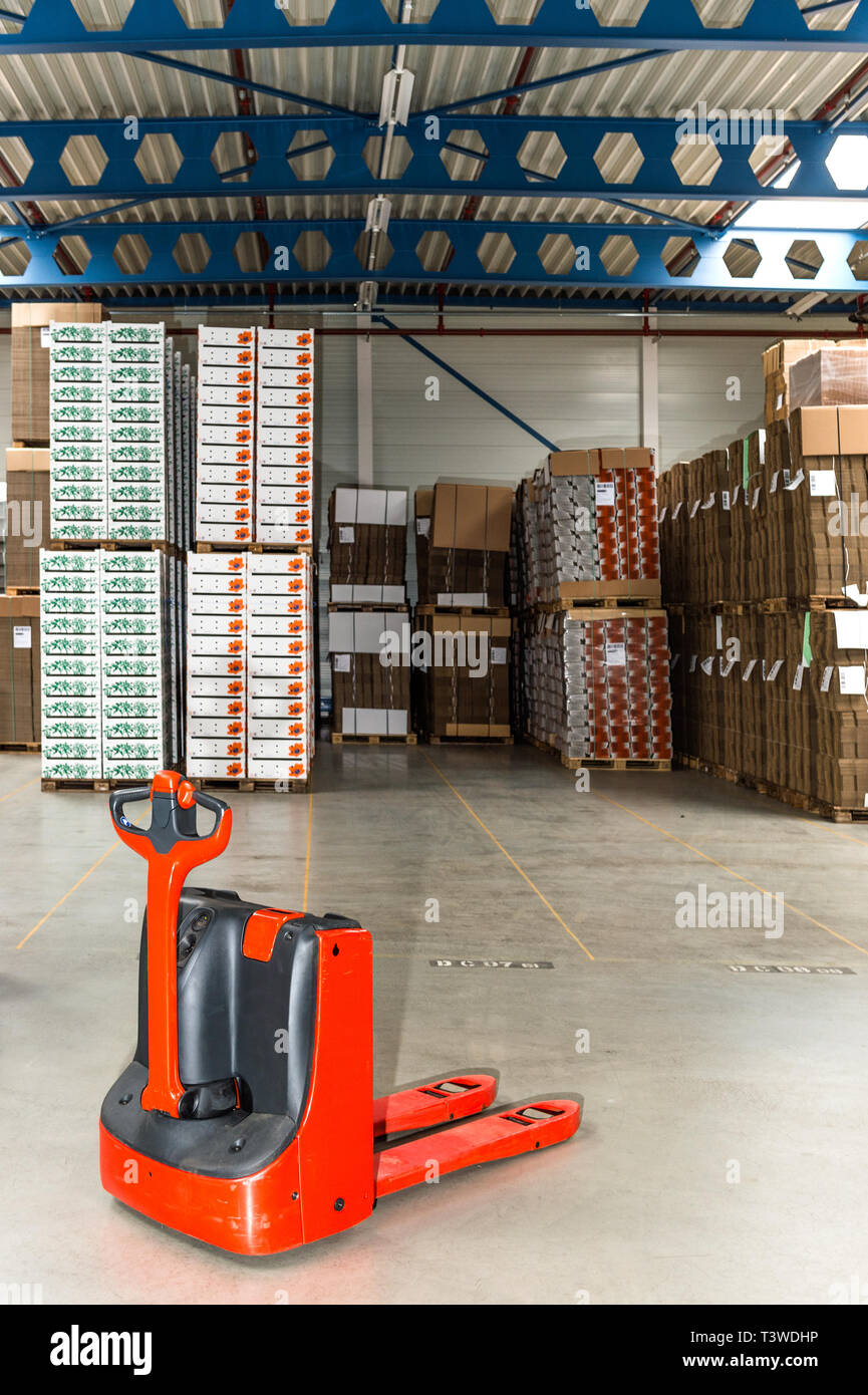 Mechanical dolly with pallets in warehouse Stock Photo Alamy