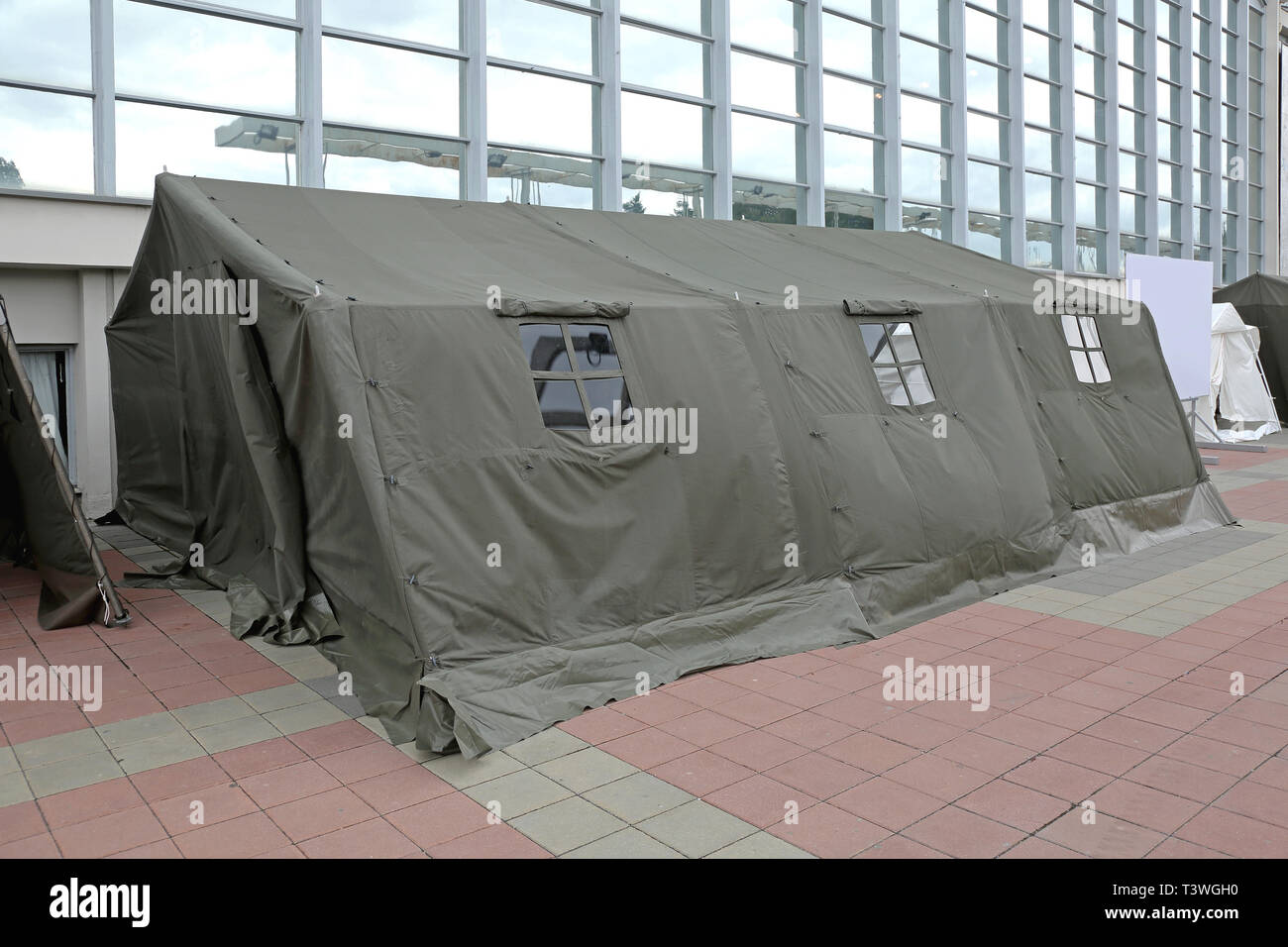 Green Tent Temporary Shelter for Disaster and Refuges Stock Photo
