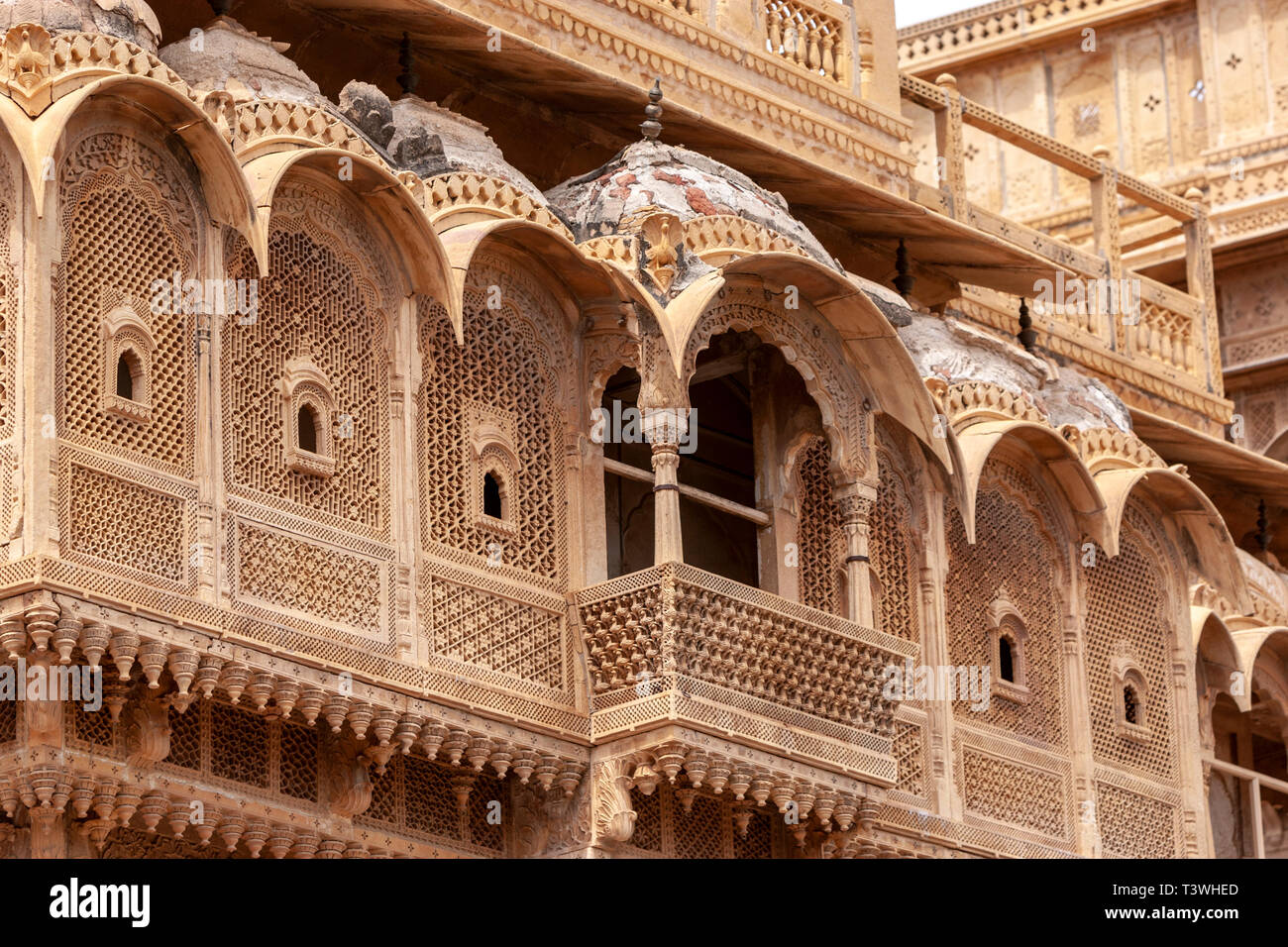 Jharokha (or jharoka) is a type of overhanging enclosed balcony in Patwon ki Haveli , Jaisalmer, Rajasthan, India Stock Photo