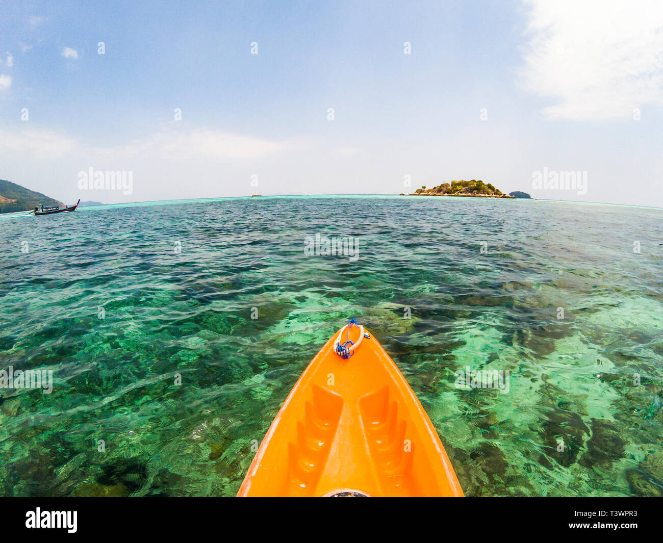 kayaking in crystal clear tropical waters kayak heading to isolated